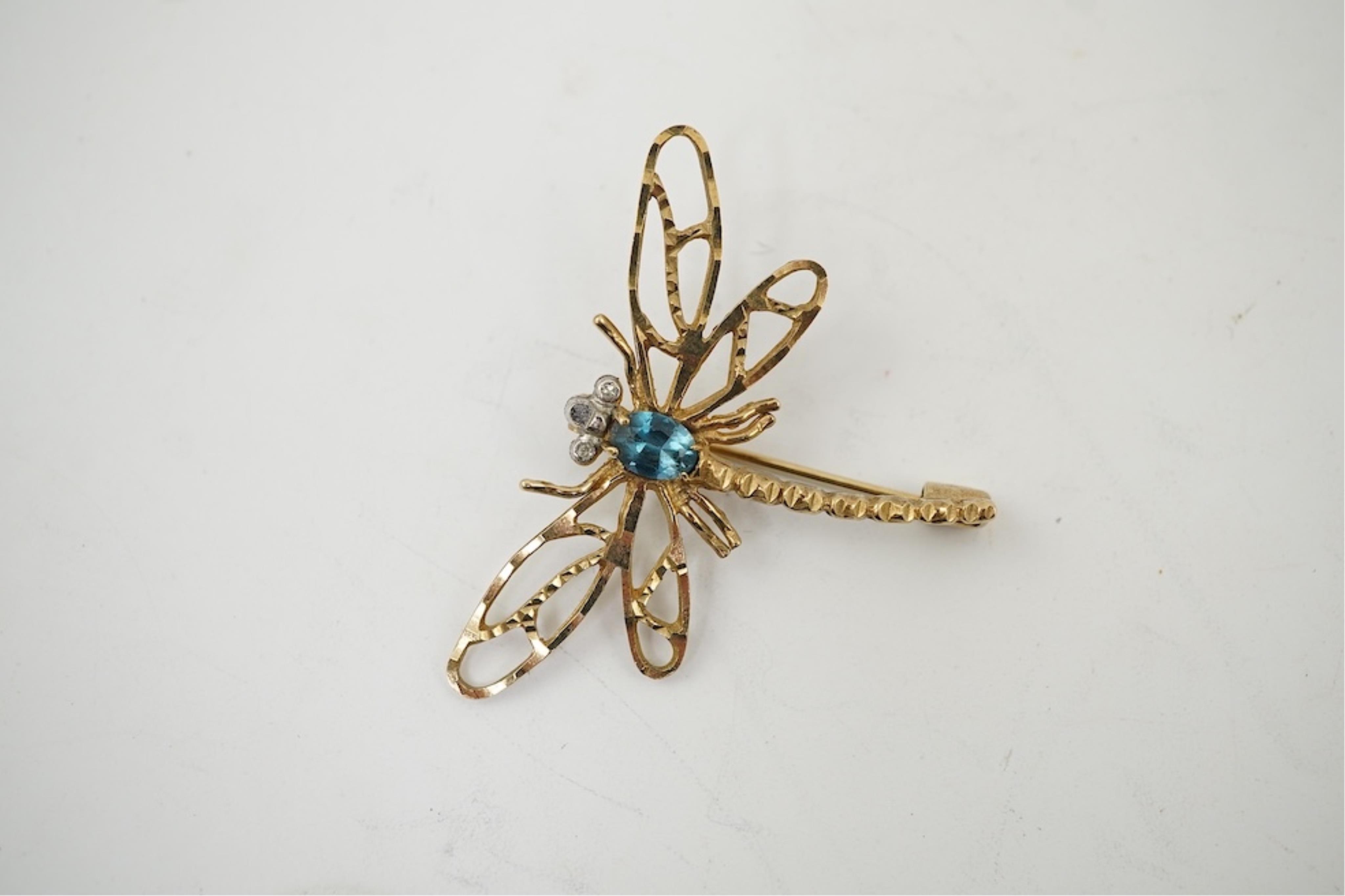 Five assorted modern 375 yellow metal and gem set pendants, a yellow metal and lapis lazuli set pendant (stamped 585?) 40mm, together with a yellow metal dragonfly brooch, a similar small pendant and a white metal bracel